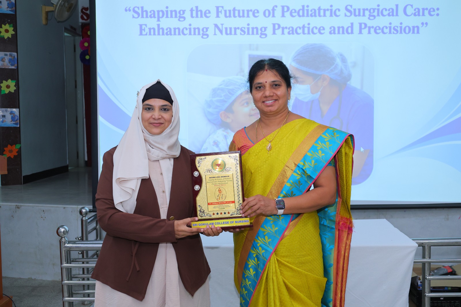 Dr. Sulthana Dhilras J receiving a memento at Sri Gokulam College of Nursing, Salem